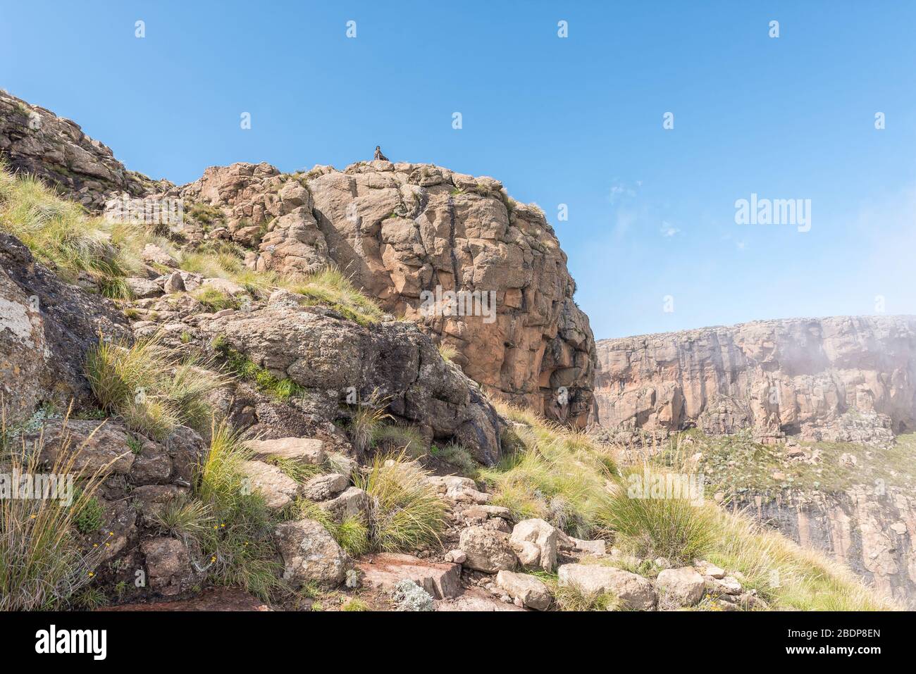 QWAQWA, SOUTH AFRICA - MARCH 3, 2020: A Basotho herdsman as seen from the top of the chain ladders on the Sentinel hiking trail to Tugela Falls Stock Photo