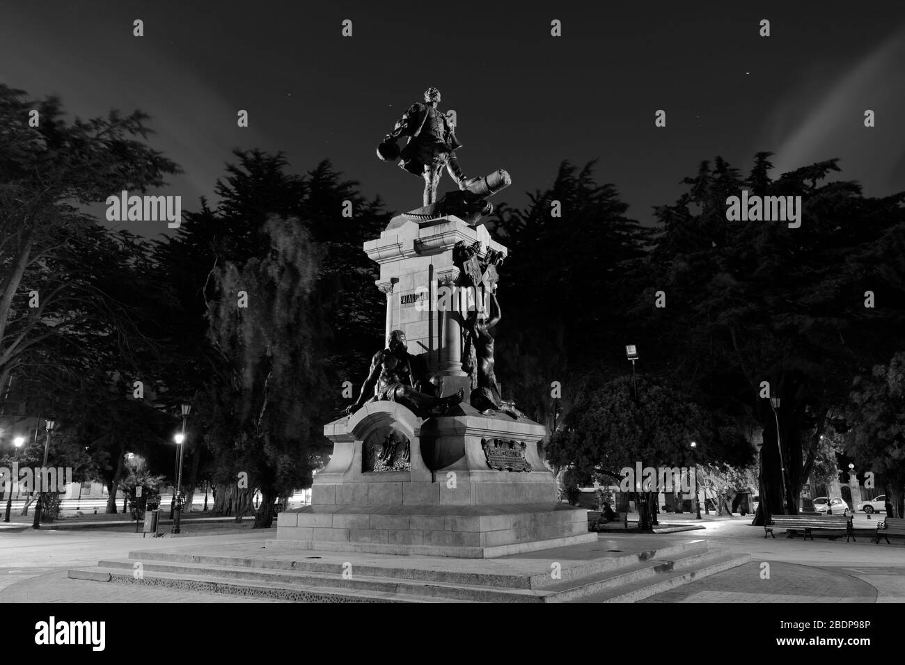 Memorial to Ferdinand Magellan at night, Plaza Armas, Punta Arenas city, Patagonia, Chile, South America Stock Photo