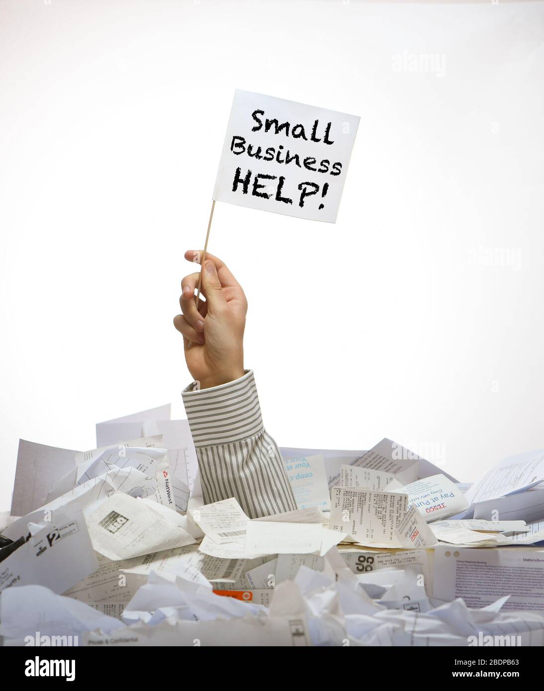 Concept image of a arm pushing up through a pile of receipts with a white flag with small business message on it under business pressure from Covid-19 Stock Photo
