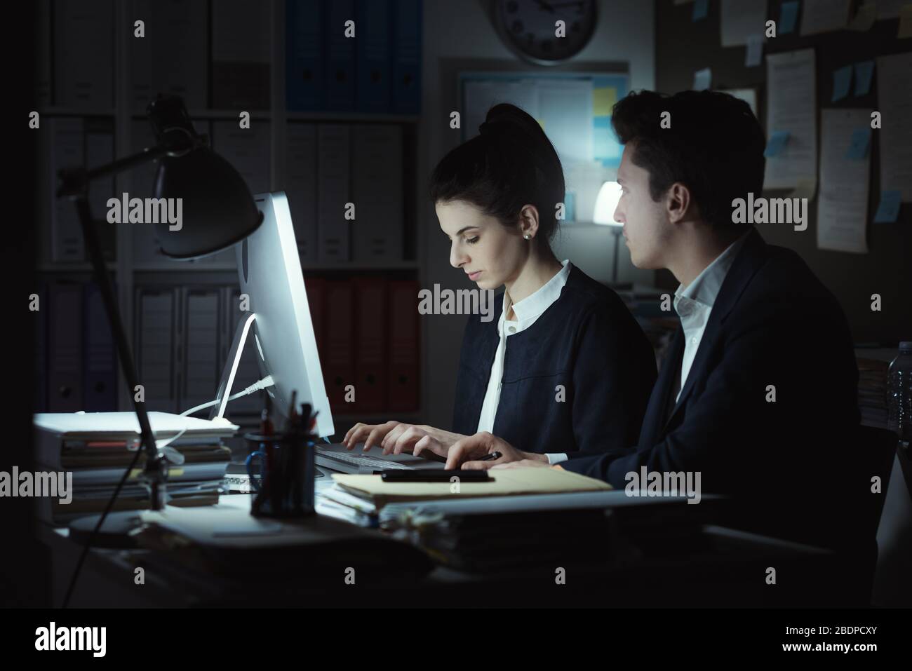 Business executives working together in the office, they are discussing ...