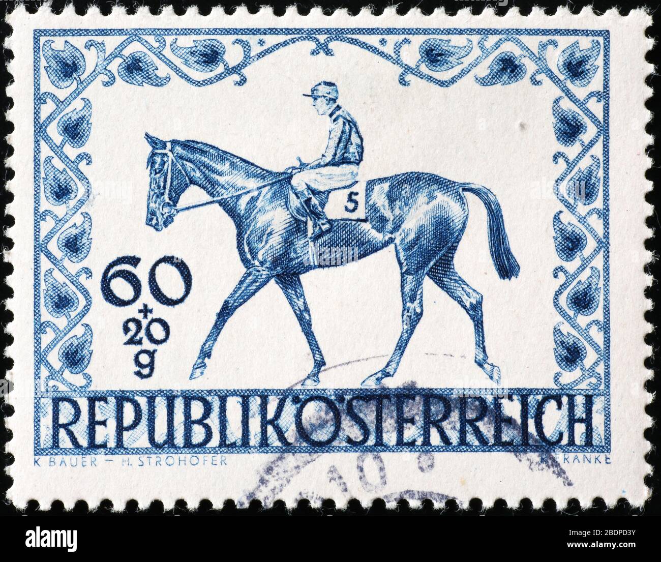 Horse and jockey on vintage austrian postage stamp Stock Photo