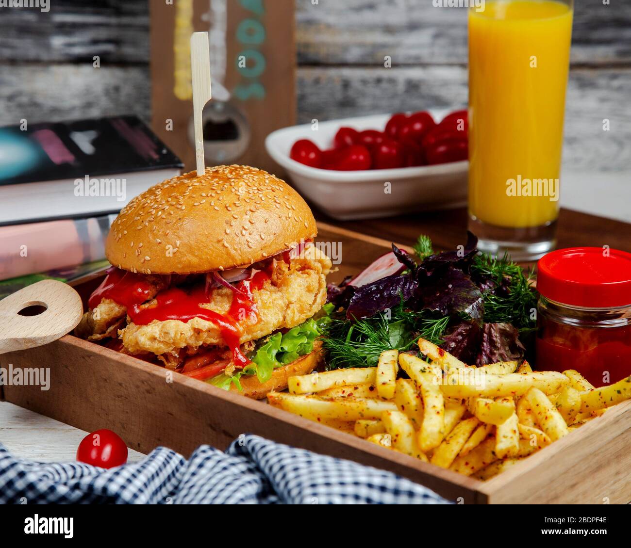 burger with herbs and spicy french fries Stock Photo Alamy