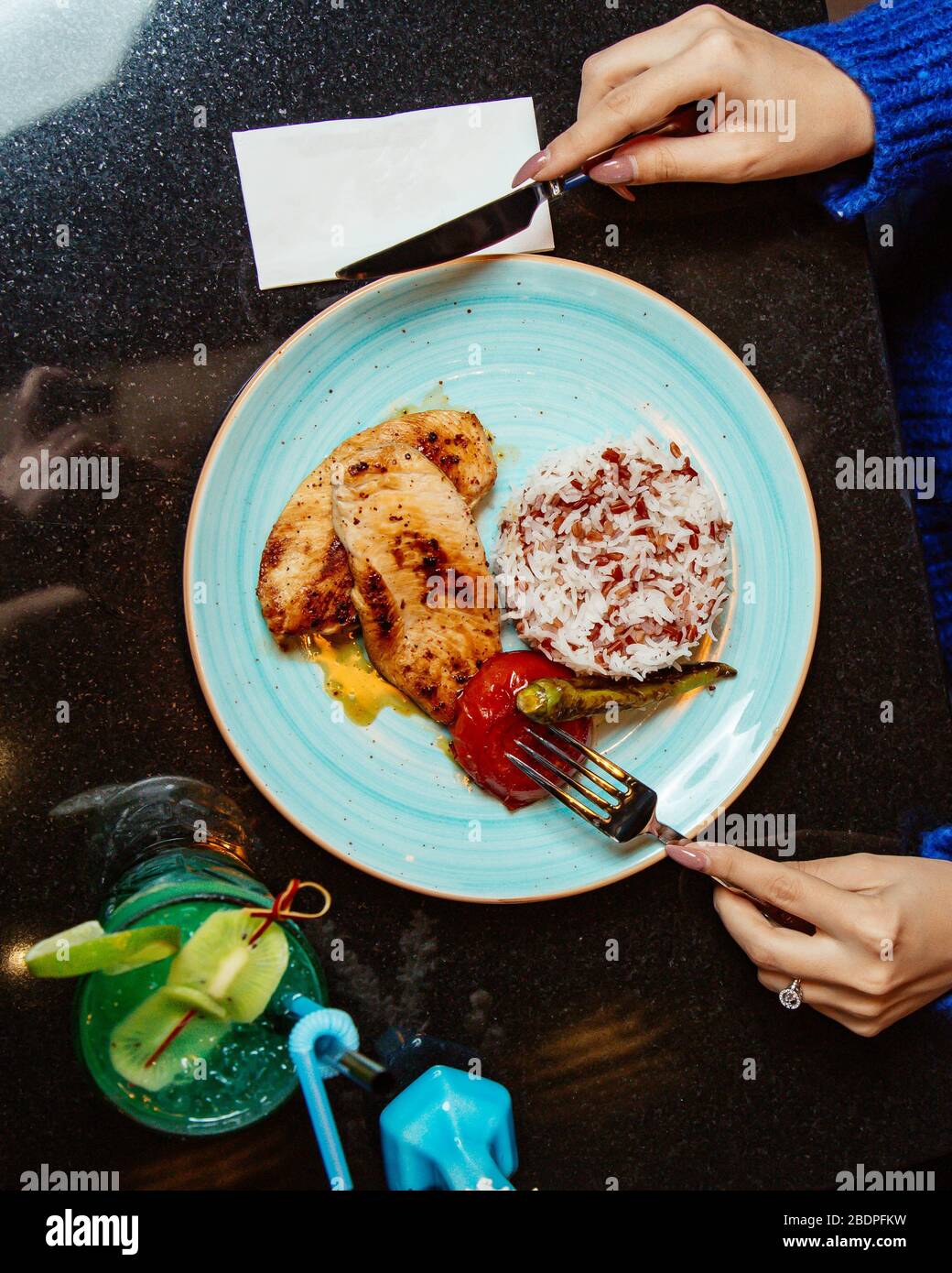 chicken cutlets and rice with fried vegetables Stock Photo Alamy