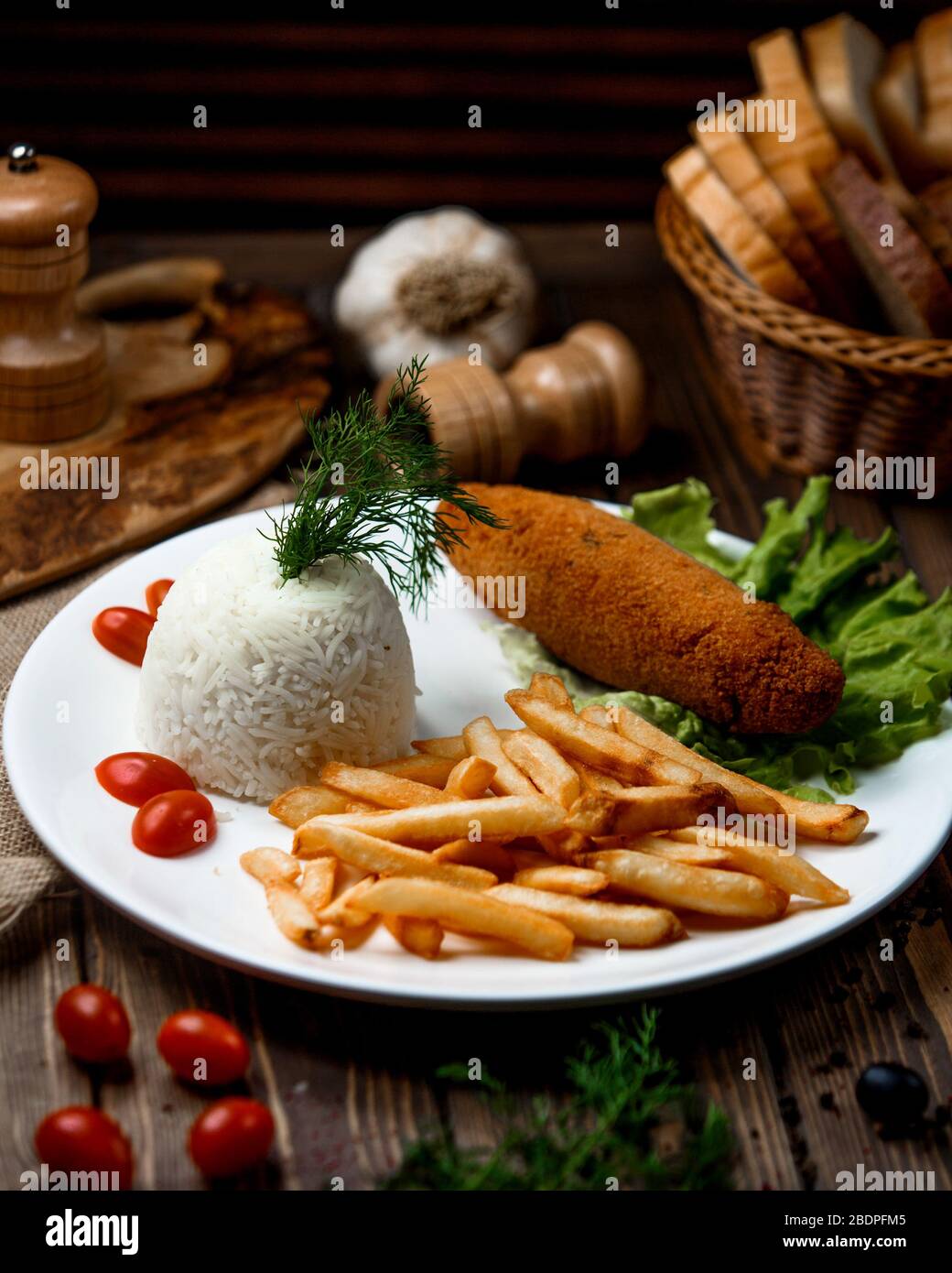 chicken cutlet with rice and fries Stock Photo Alamy