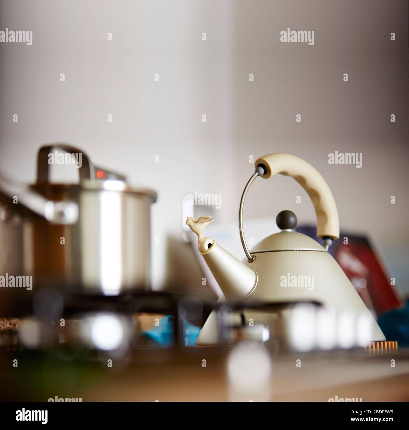 Bright steaming tea kettle stands on a kitchen countertop, ready to brew a  fresh cup of hot tea. Stock Illustration