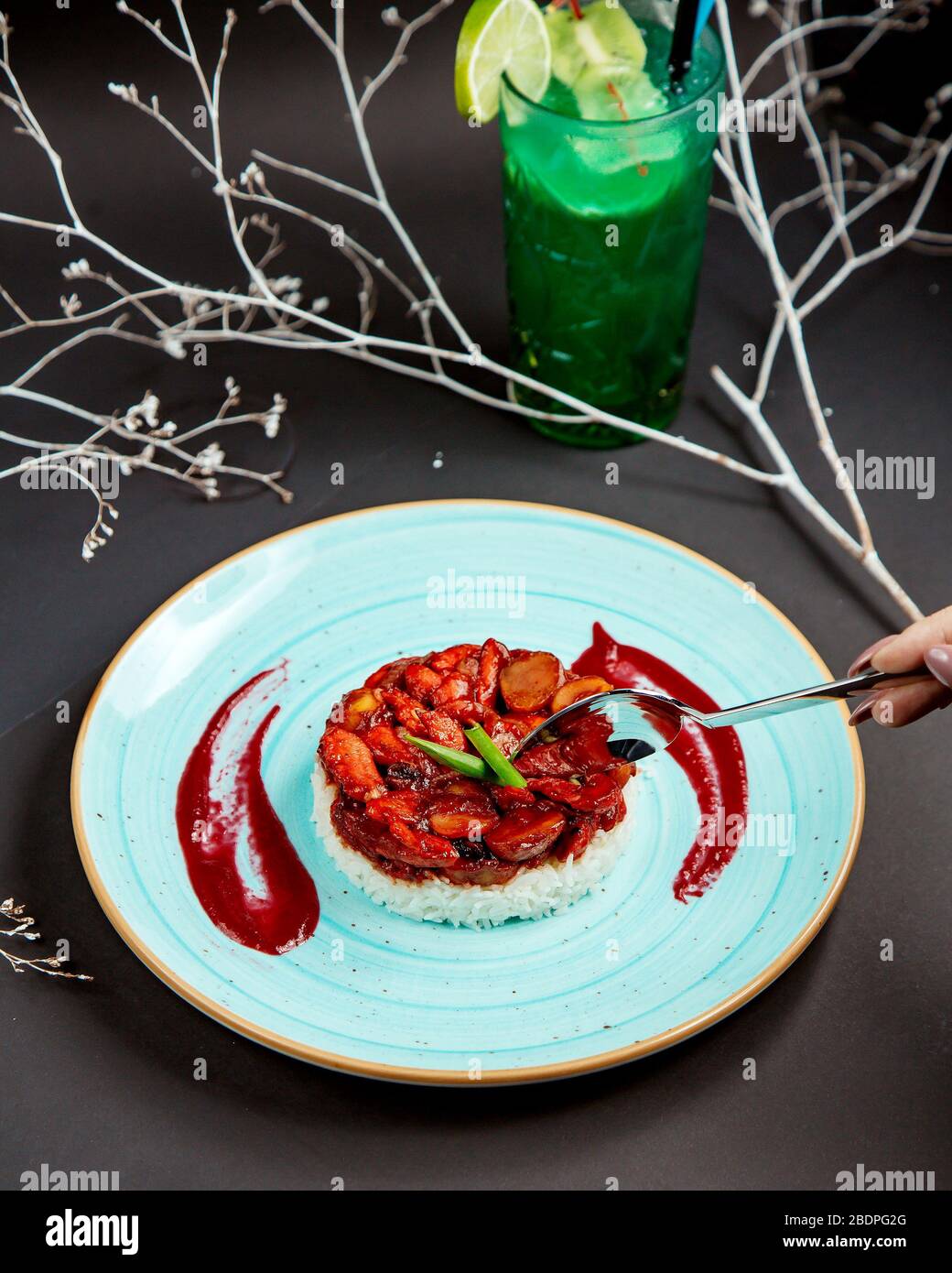 chopped meat in tomato with rice Stock Photo Alamy