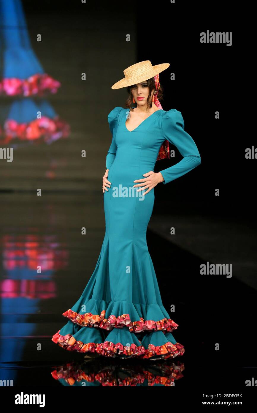 SEVILLA, SPAIN - JAN 30: Model Martina Carrillo wearing a dress from the En Tierra Extrana collection by designer Maria Fernandez Fuentes as part of the SIMOF 2020 (Photo credit: Mickael Chavet) Stock Photo