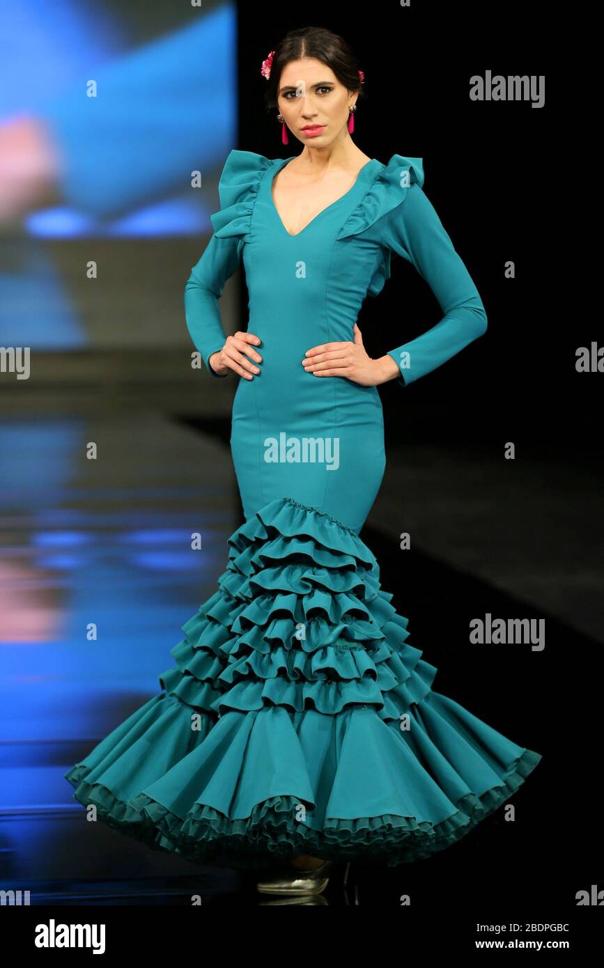 SEVILLA, SPAIN - JAN 30: Model wearing a dress from the En Tierra Extrana collection by designer Maria Fernandez Fuentes as part of the SIMOF 2020 (Photo credit: Mickael Chavet) Stock Photo