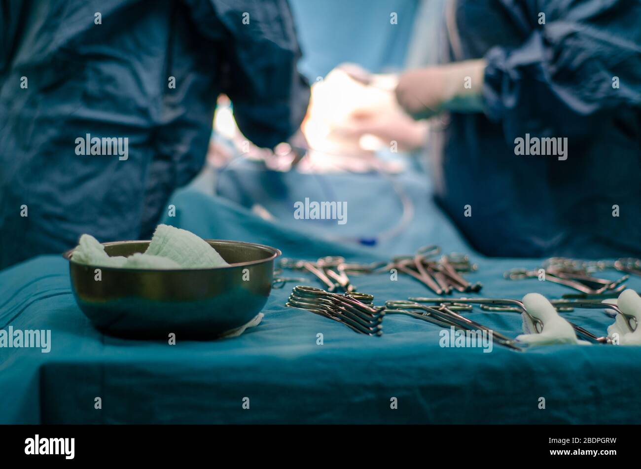Surgical tools displayed on a surgical table while surgeons are