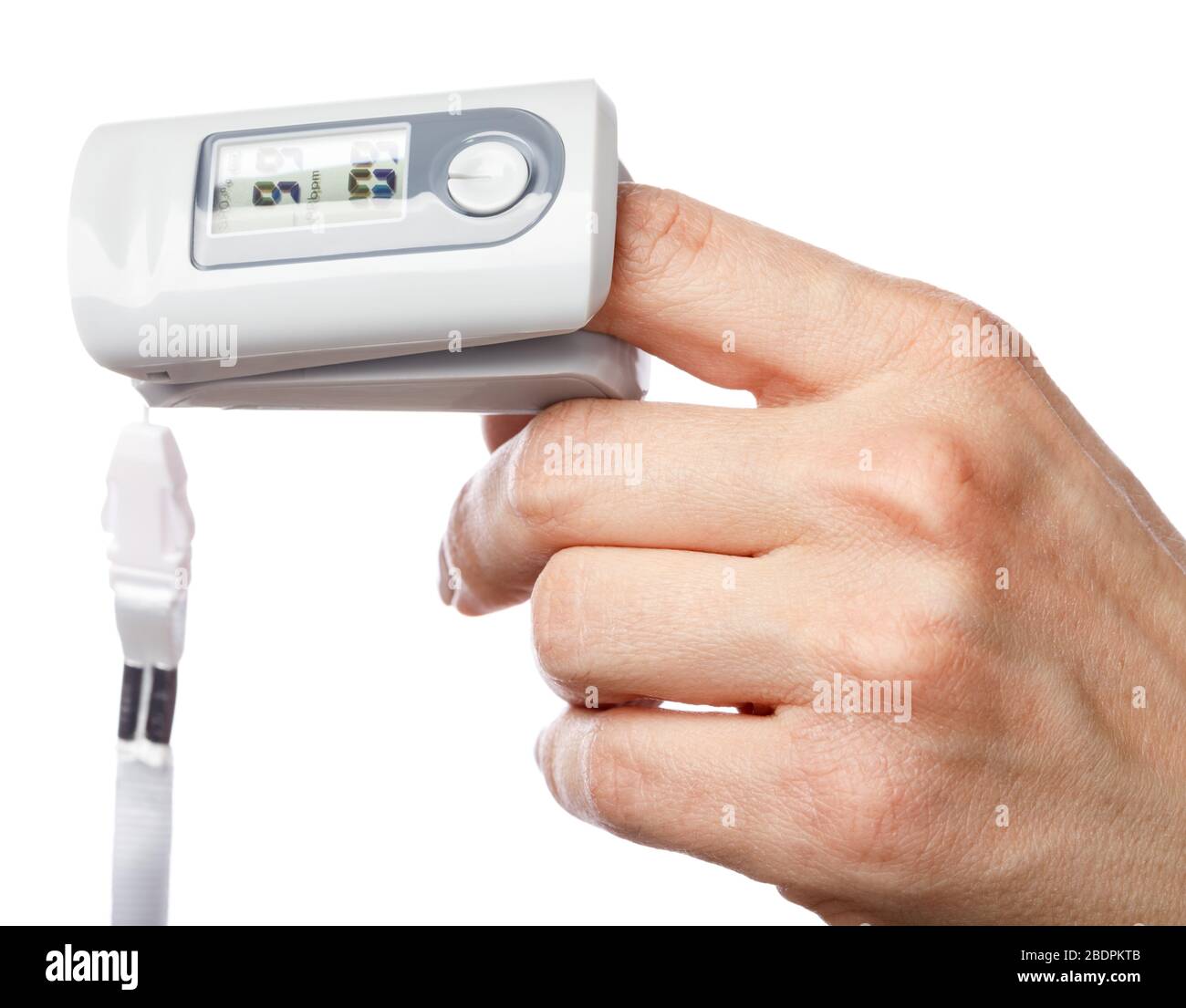 Close-up shot of person using finger pulse oximeter to check oxygen saturation and heart rate tracking coronavirus symptoms - epidemic virus outbreak Stock Photo