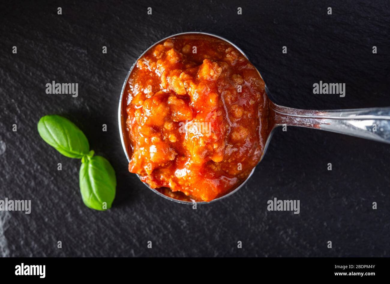 Italian bolognese sauce in spoon - top view Stock Photo