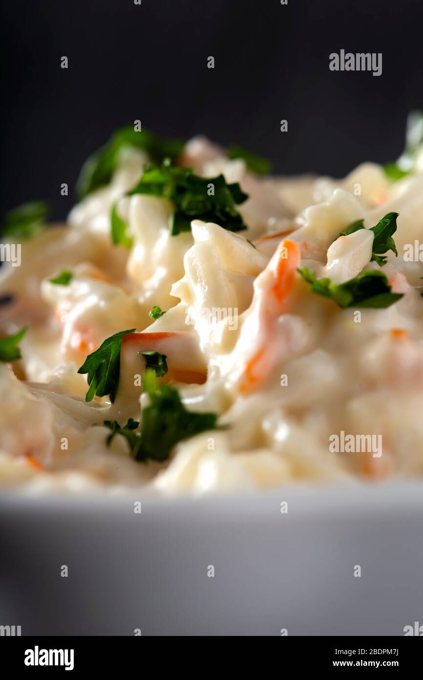 Salad of surimi with mayonnaise sauce and herbs - close up view Stock Photo