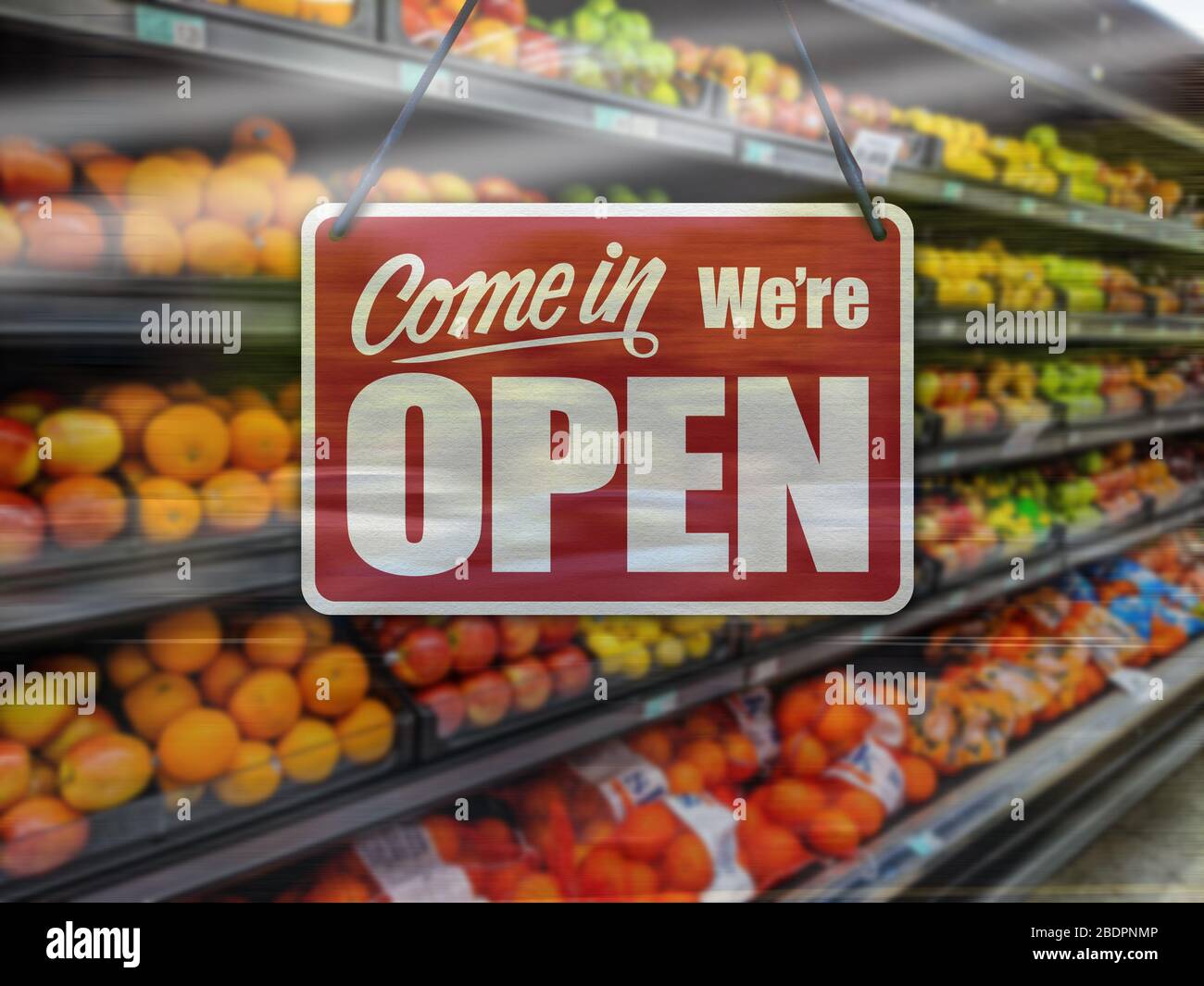 A business sign that says 'Come in We're Open' on supermarket or convenience store window. Stock Photo