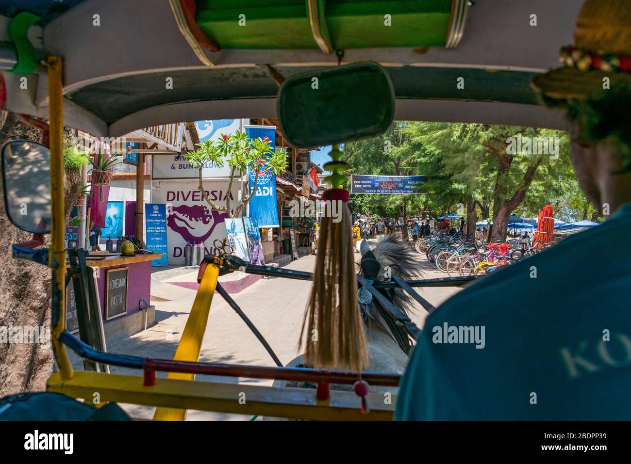 Horizontal view from inside a traditional horse-drawn taxi in Gili Trawangan, Indonesia. Stock Photo