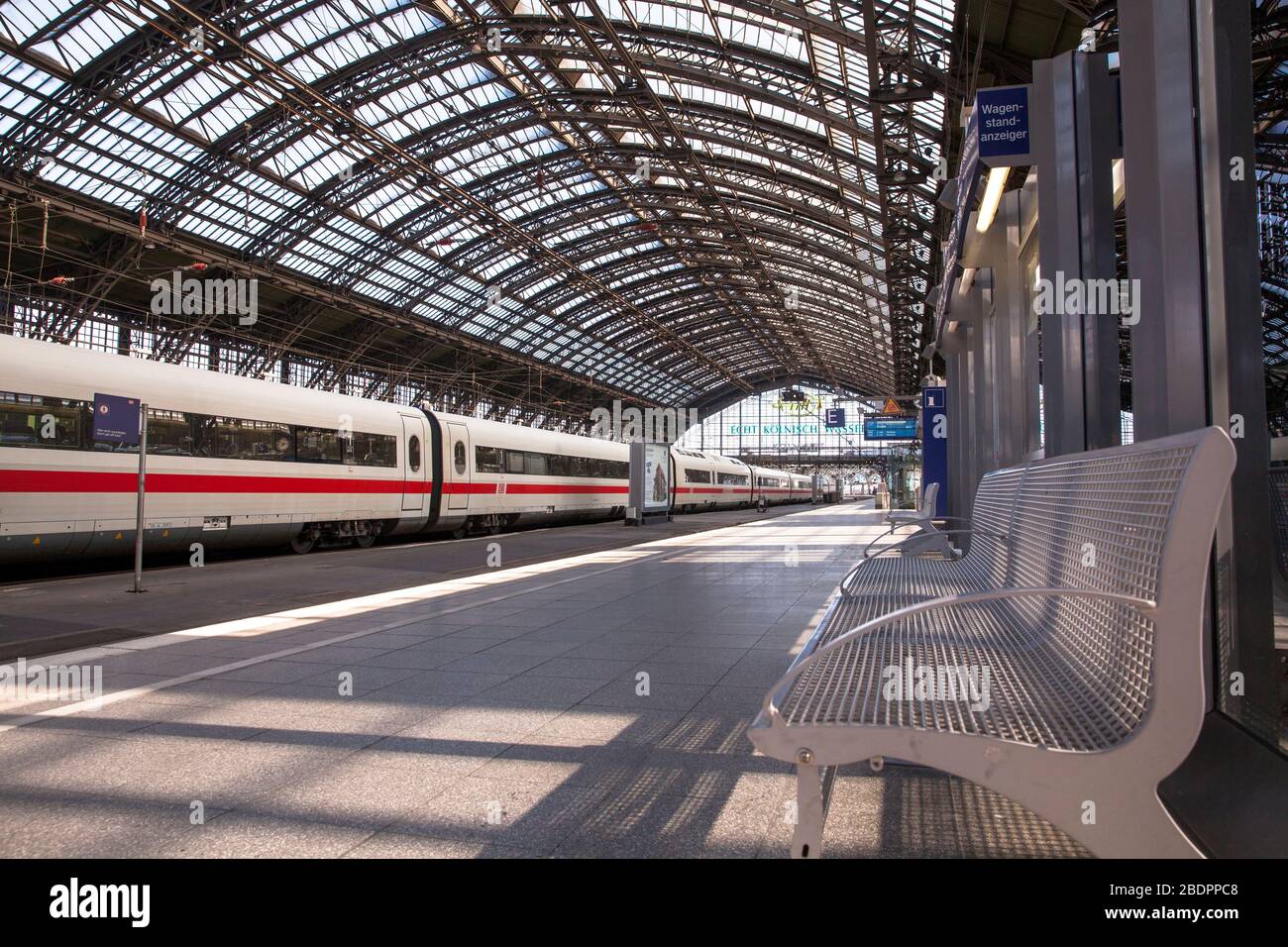 Coronavirus / Covid 19 outbreak, April 7th. 2020. Empty platforms and only few trains and travellers at the main station, Cologne, Germany.  Coronavir Stock Photo
