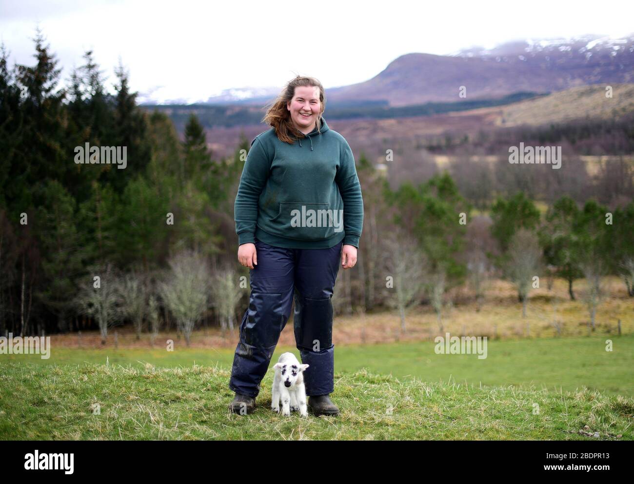 EDITORIAL USE ONLY Chloe Malcolm, aged 25, tends to a new lamb as she has been appointed as manager of one of Scotland's biggest upland farming operations. She will oversee 12,000 acres of hill farm and 600 sheep in Glenshero and Inverlair for Jahama Highland Estates, part of the GFG Alliance industrial group. Stock Photo