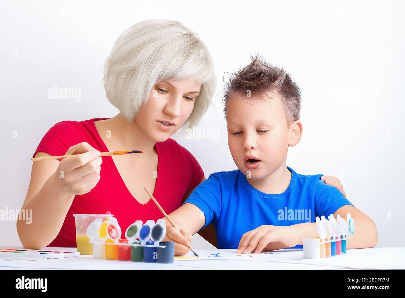 Pretty Young Girl Teaches Drawing A Cute Boy Mom And Son Painting Together Education Personal Lessons Leisure Family Activities During Quarantine Stock Photo Alamy