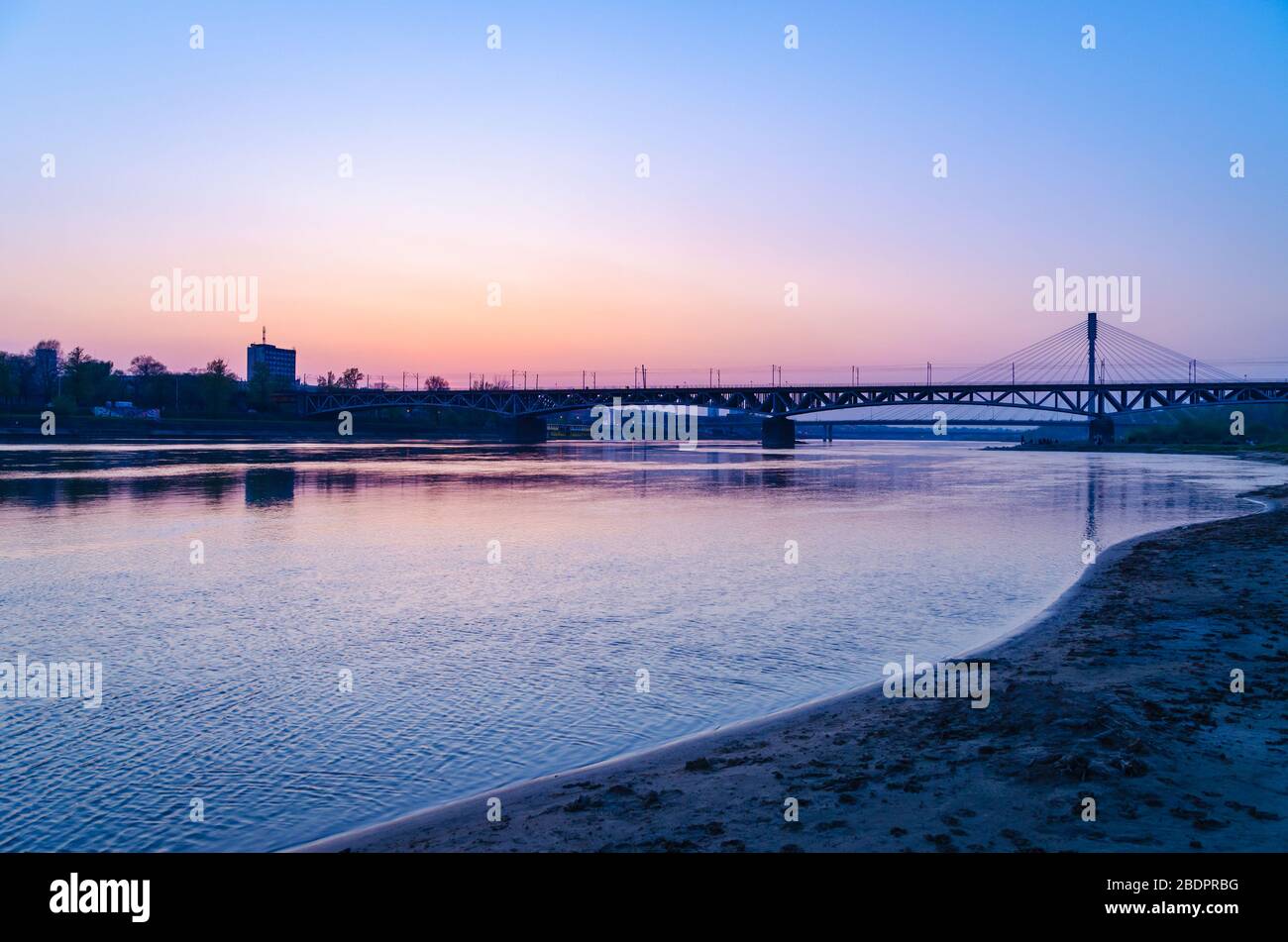 The Wisla River and the Świetokrzyski Bridge in Warsaw in the evening Stock Photo