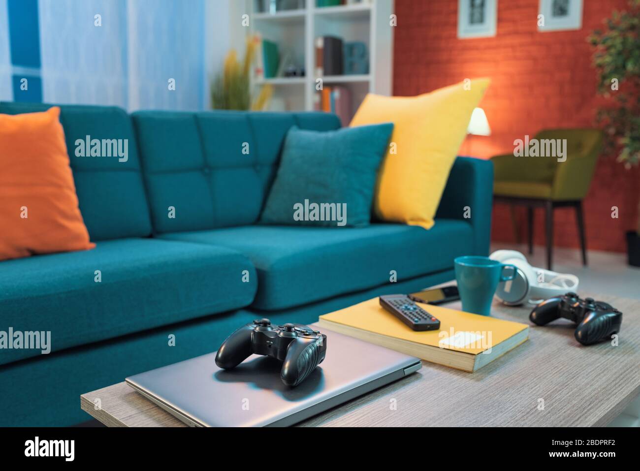 Colorful living room interior with couch, video game controller in the