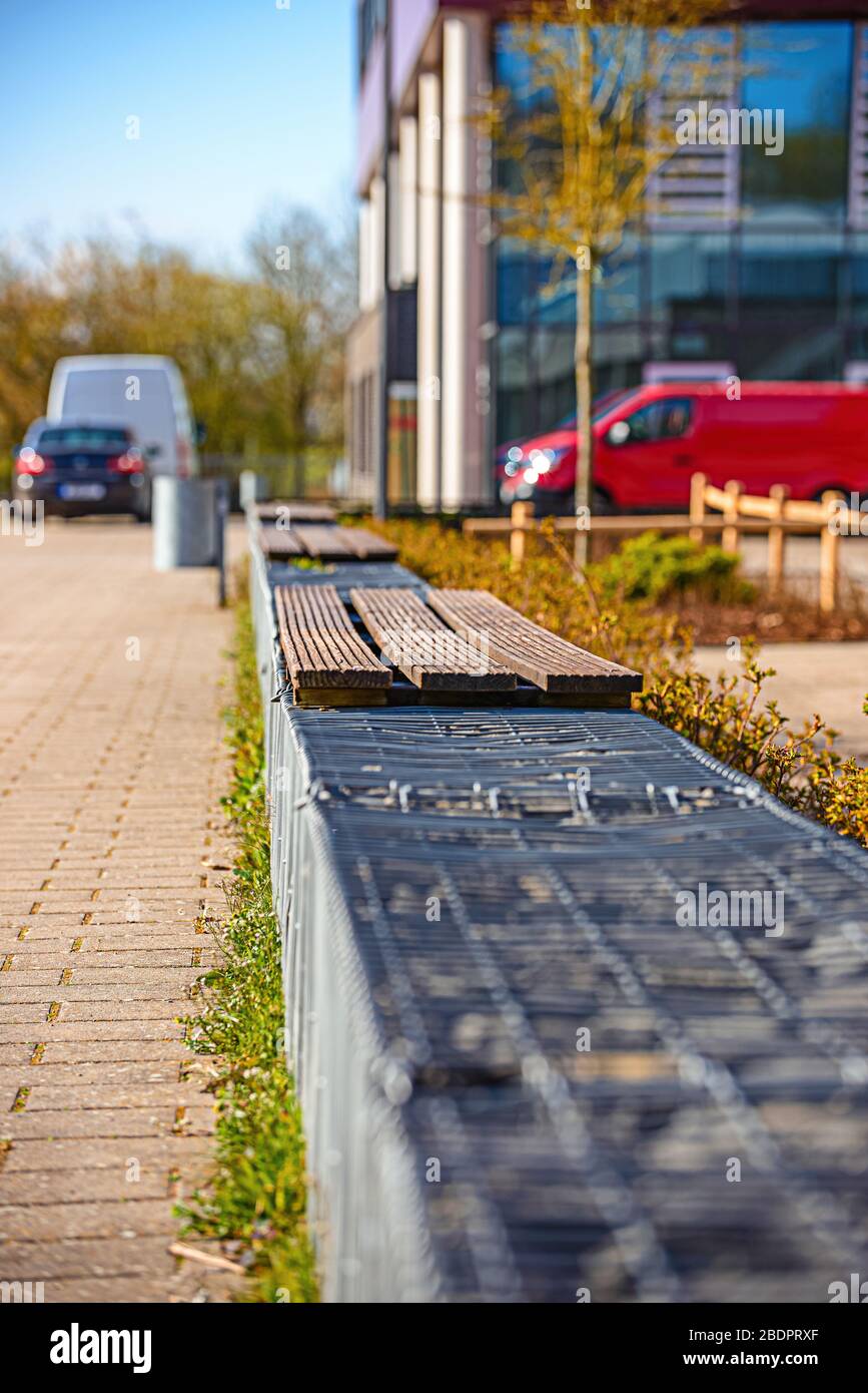 Wooden benches in the park in spring Stock Photo - Alamy