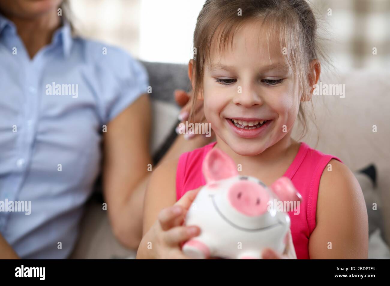 Girl holding money box Stock Photo Alamy
