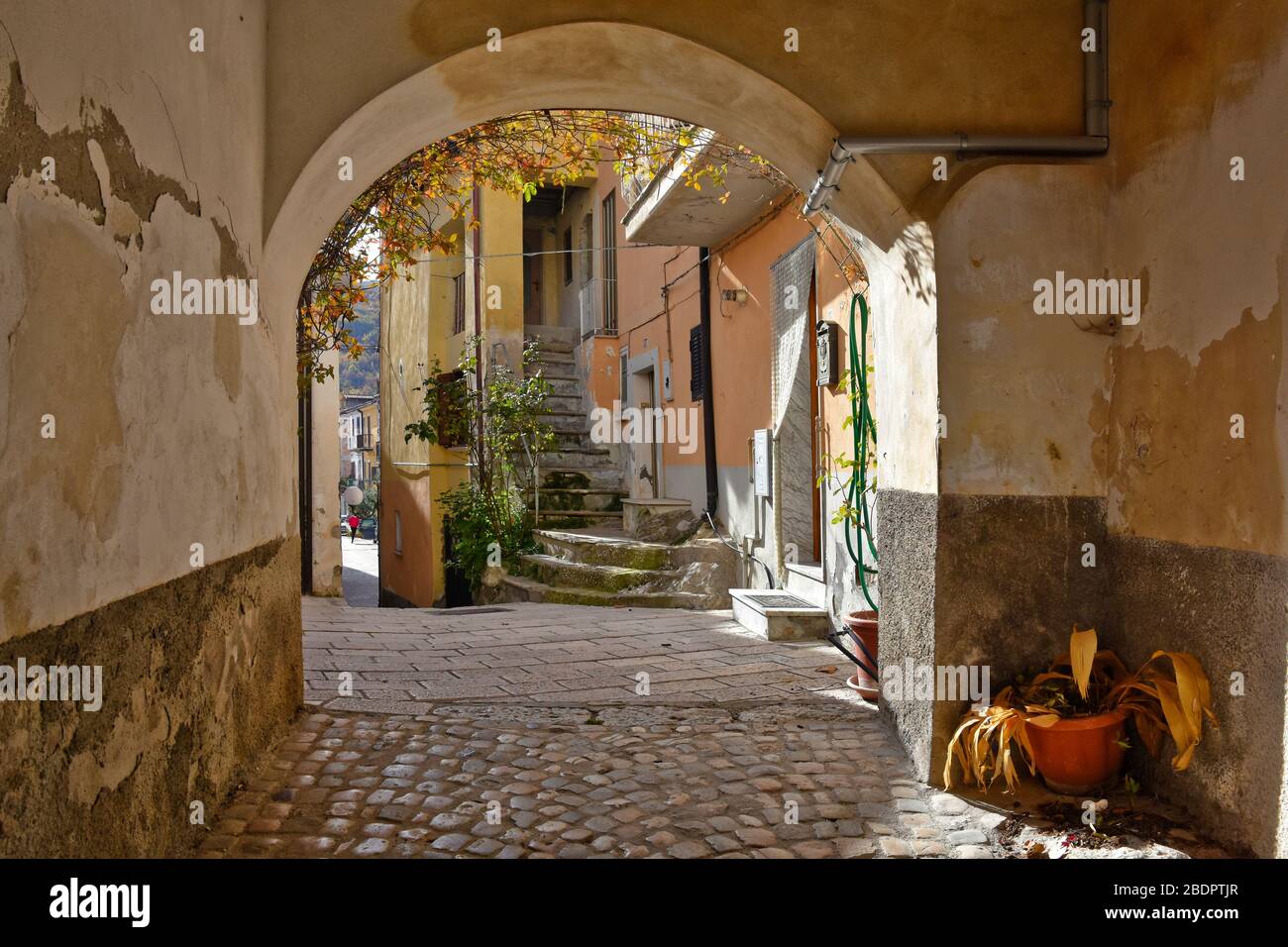 A narrow street between the houses of Civitanova del Sannio, a town in ...