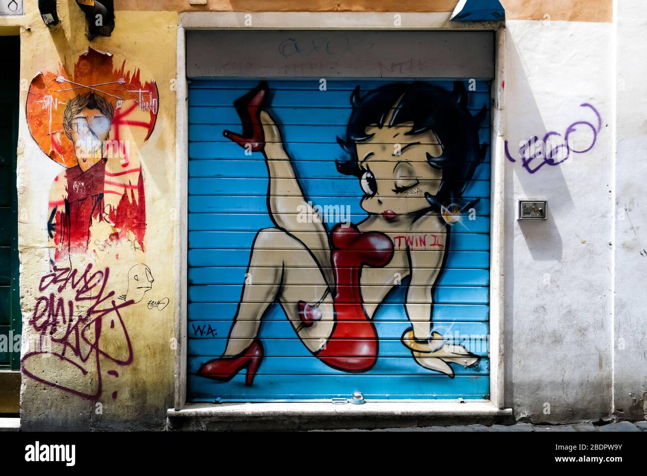 Betty Boop painted on a blue background of a closed rolling shutter. Shop front door, store. Rome, Italy, Europe, EU Stock Photo