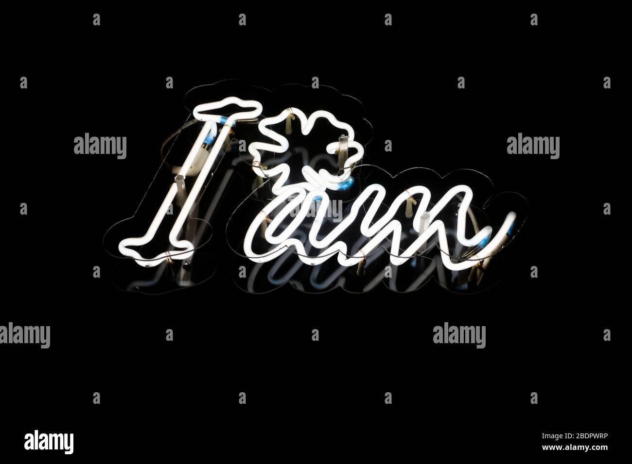 I am concept, white neon light sign on a black background, close up, detail. Stock Photo