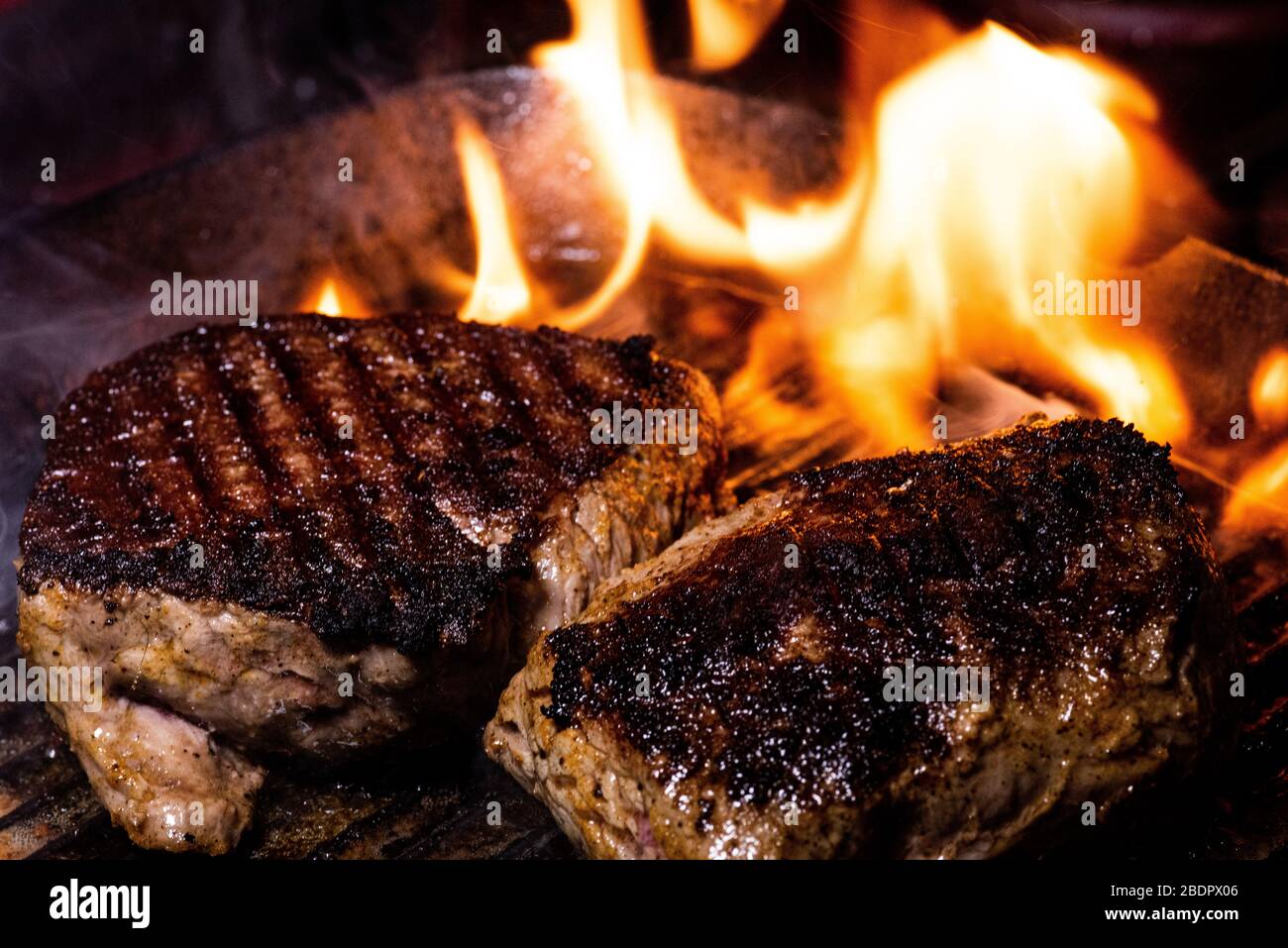 steak on a cast iron griddle Stock Photo Alamy