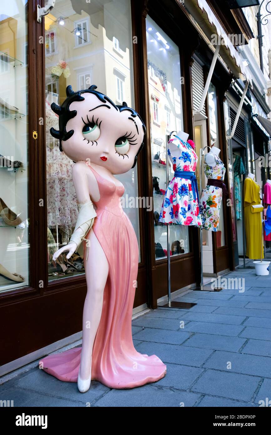 A rare large Betty Boop model figure standing on display in front of a shop. Trieste, Friuli Venezia Giulia, Italy, Europe, EU Stock Photo