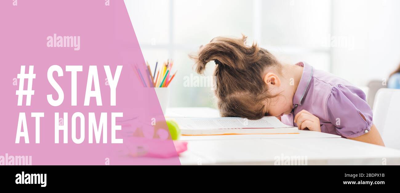 Humorous Coronavirus stay at home social media awareness campaign: sad bored girl studying at home and lying her head on the book Stock Photo