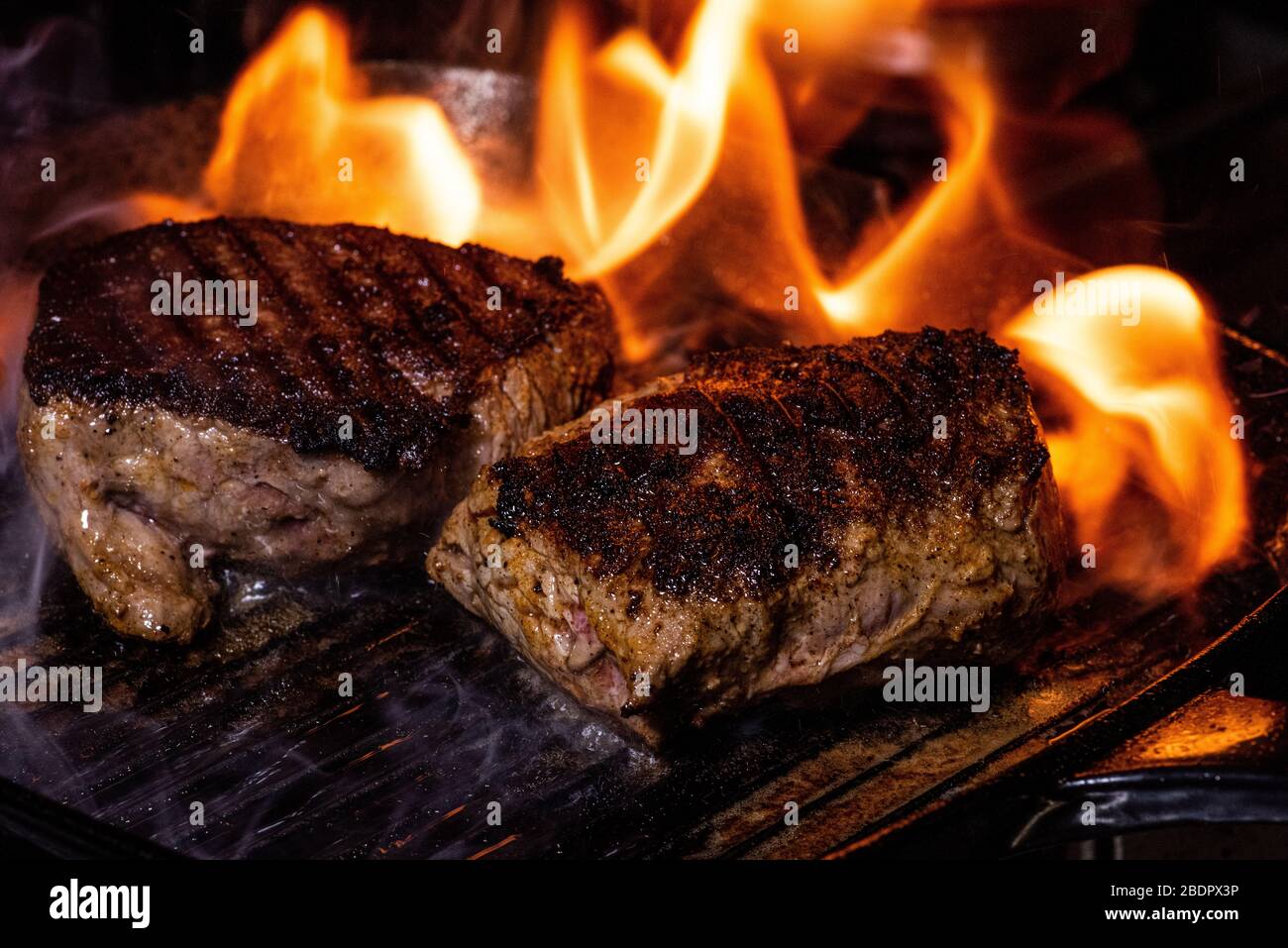 steak on a cast iron griddle Stock Photo