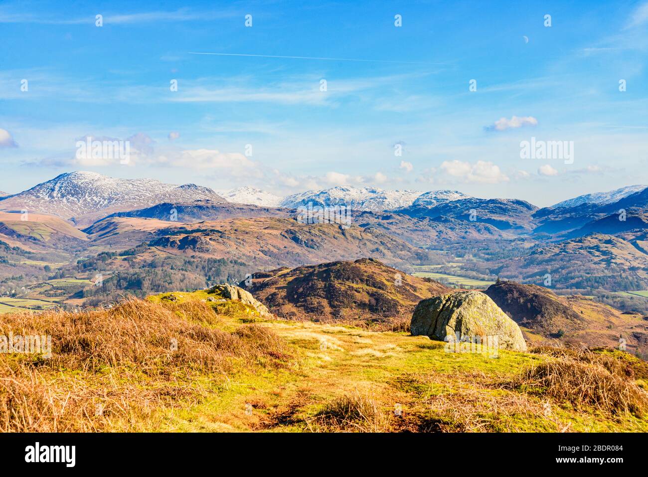 On Muncaster Fell above Eskdale in the English Lake District. Skyline fells include Scafell, Bowfell, and Crinkle Crags. Stock Photo