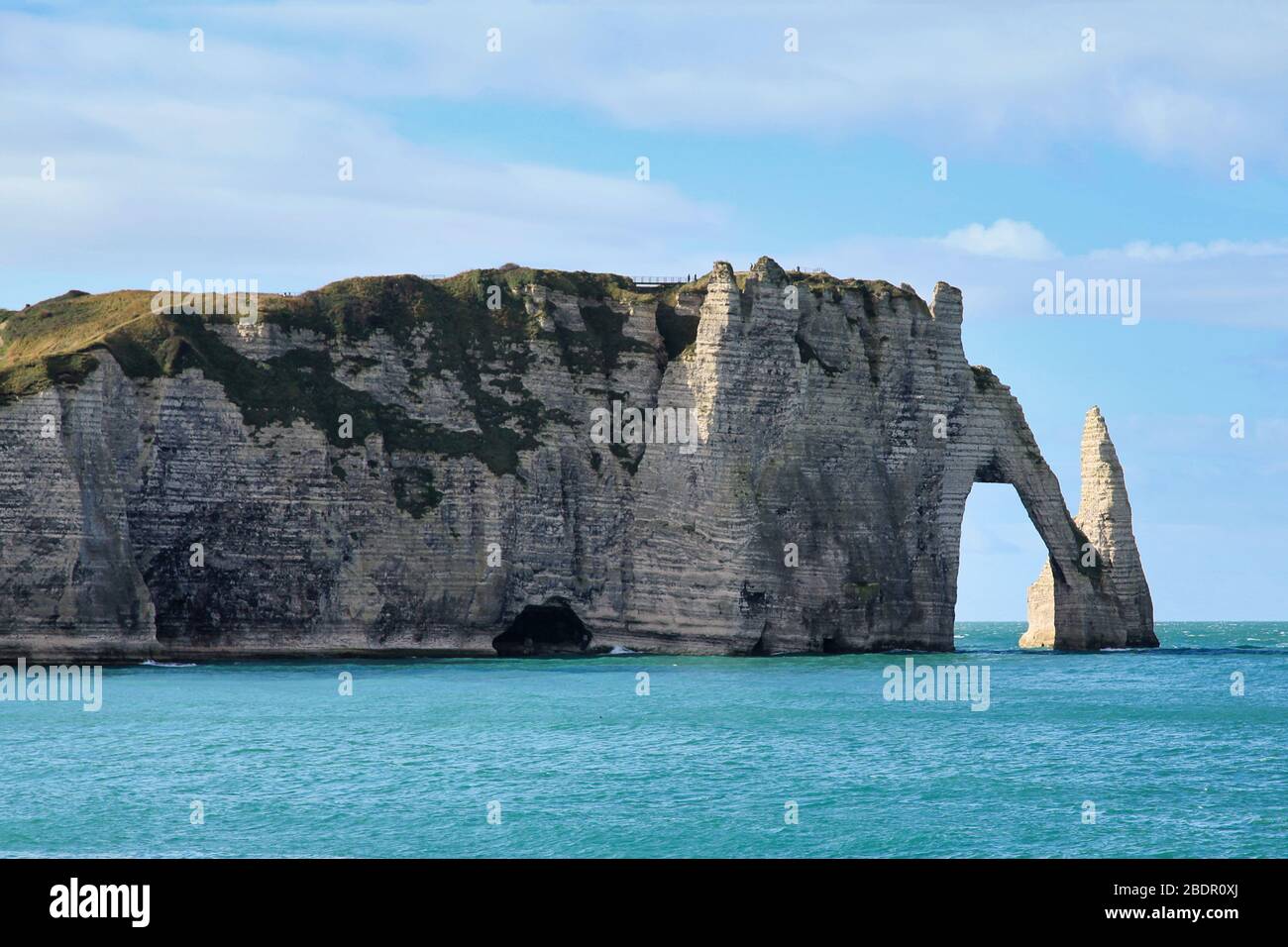 The cliffs of Etretat with it natural arch "Pont daval" and its needle ...