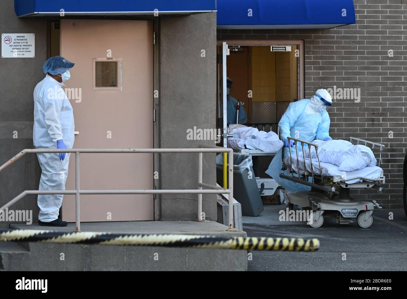 A body being taken to a refrigerated truck at Wyckoff Heights Medical