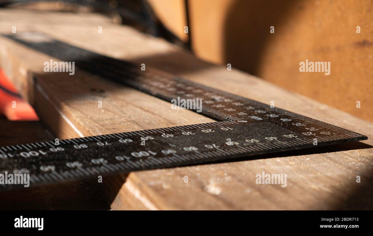 Measuring ruler tool 90 degrees. Work space in the Workshop Stock Photo ...
