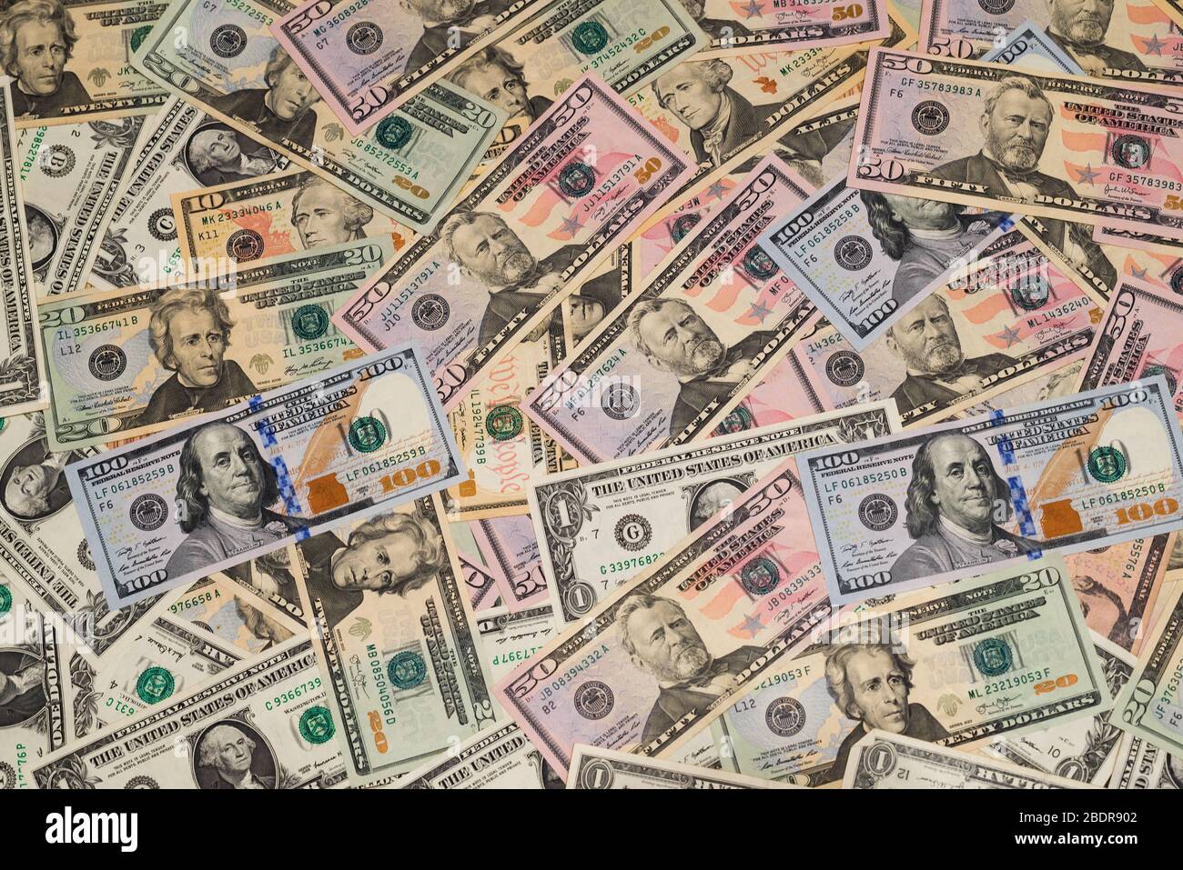 Background from American dollar bills of various denominations and years of issue Stock Photo