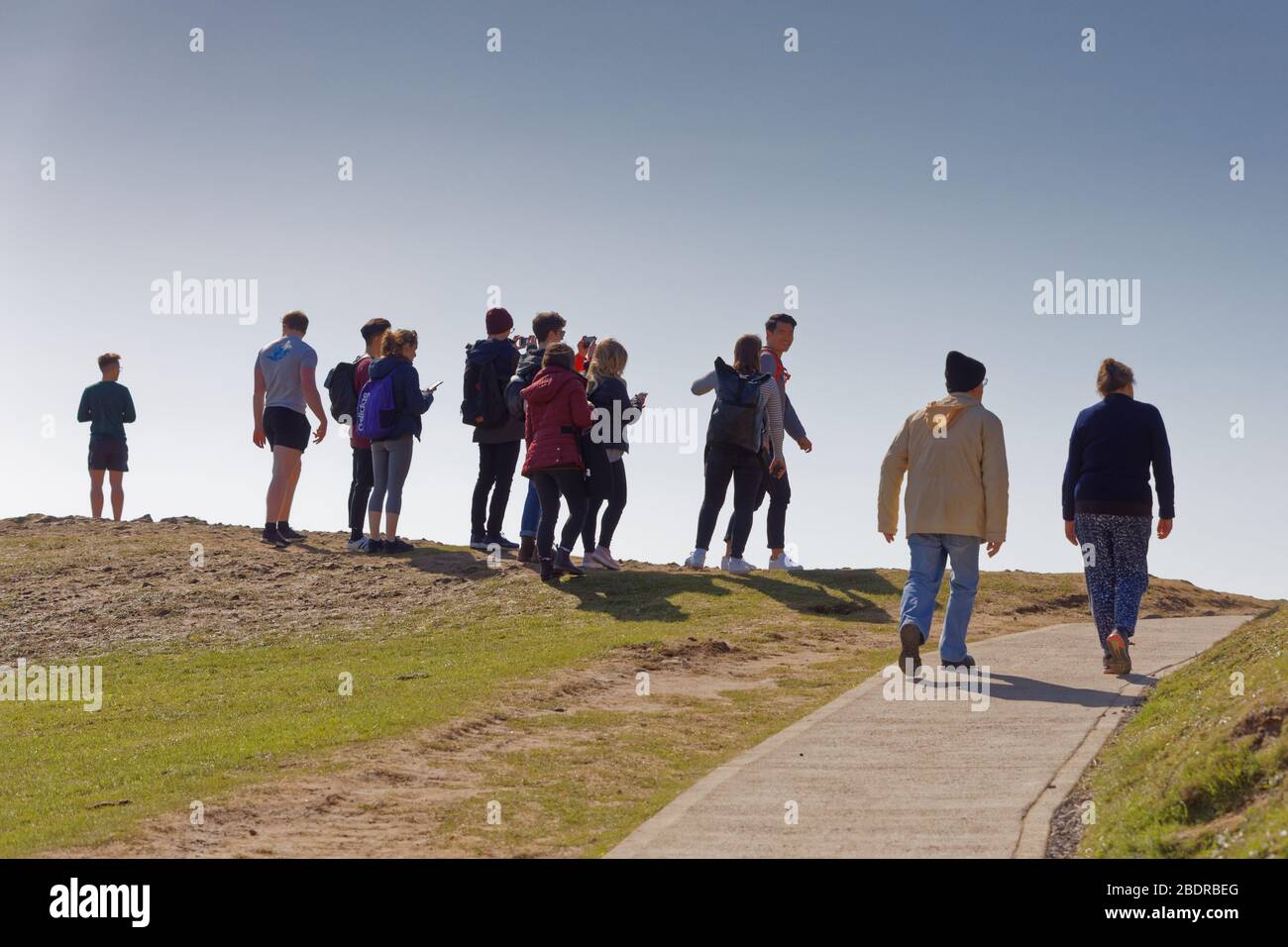 Pictured: A group of walkers on the coastal path by Langland Bay near Swansea, Wales, UK. Sunday 22 March 2020 Re: Covid-19 Coronavirus pandemic, UK. Stock Photo