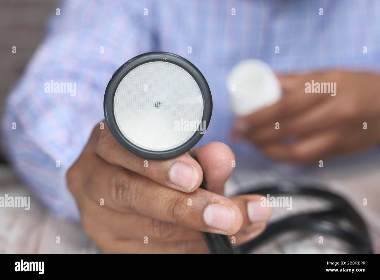 Doctor using stethoscope in hospital hi-res stock photography and ...