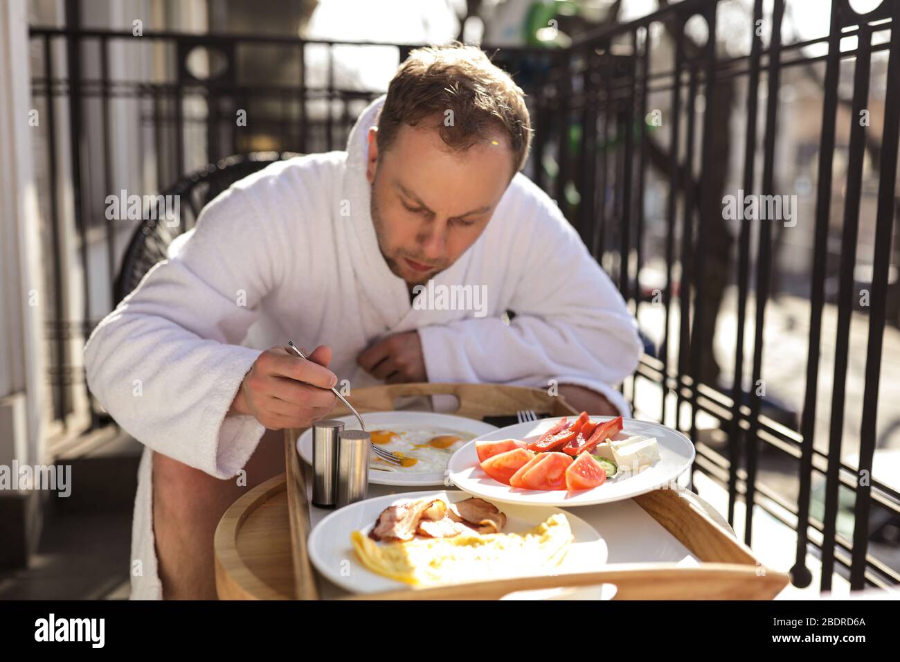 Good looking hungry man having his meal Stock Photo - Alamy
