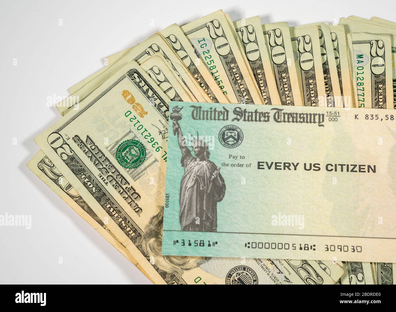 Stack of 20 dollar bills with US Treasure illustrative check to