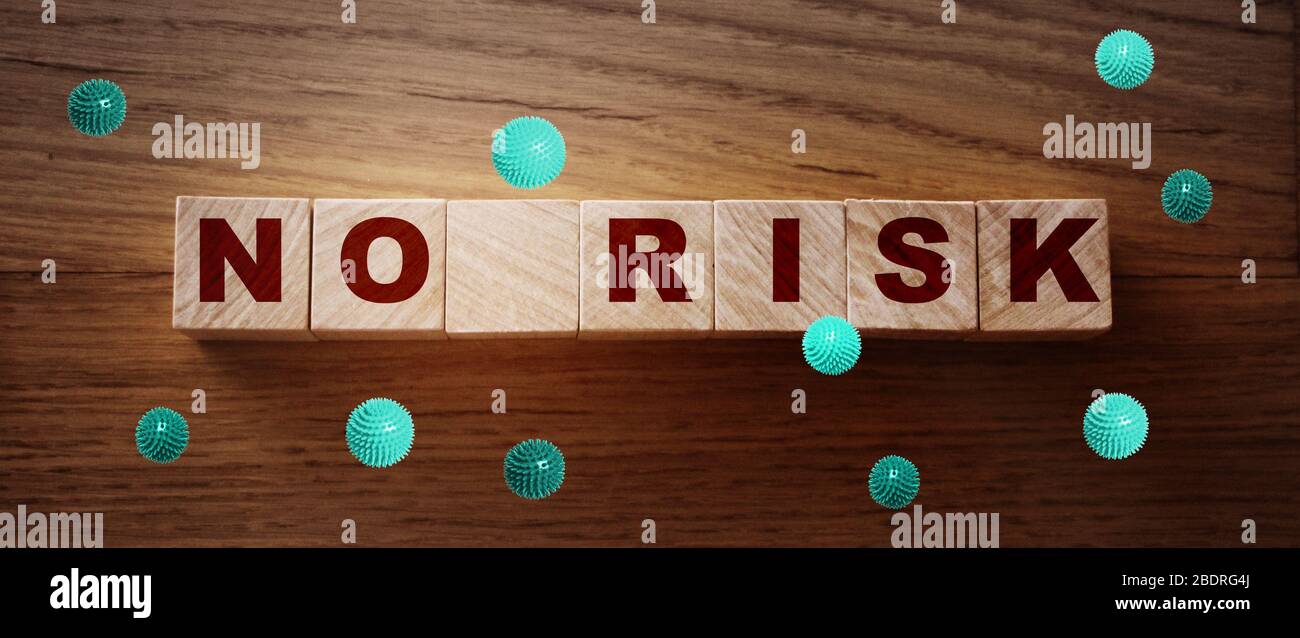 No risk words letters on wooden cubes ans coronavirus particles around. Coronavirus risks alert covid-19 prevention concept Stock Photo