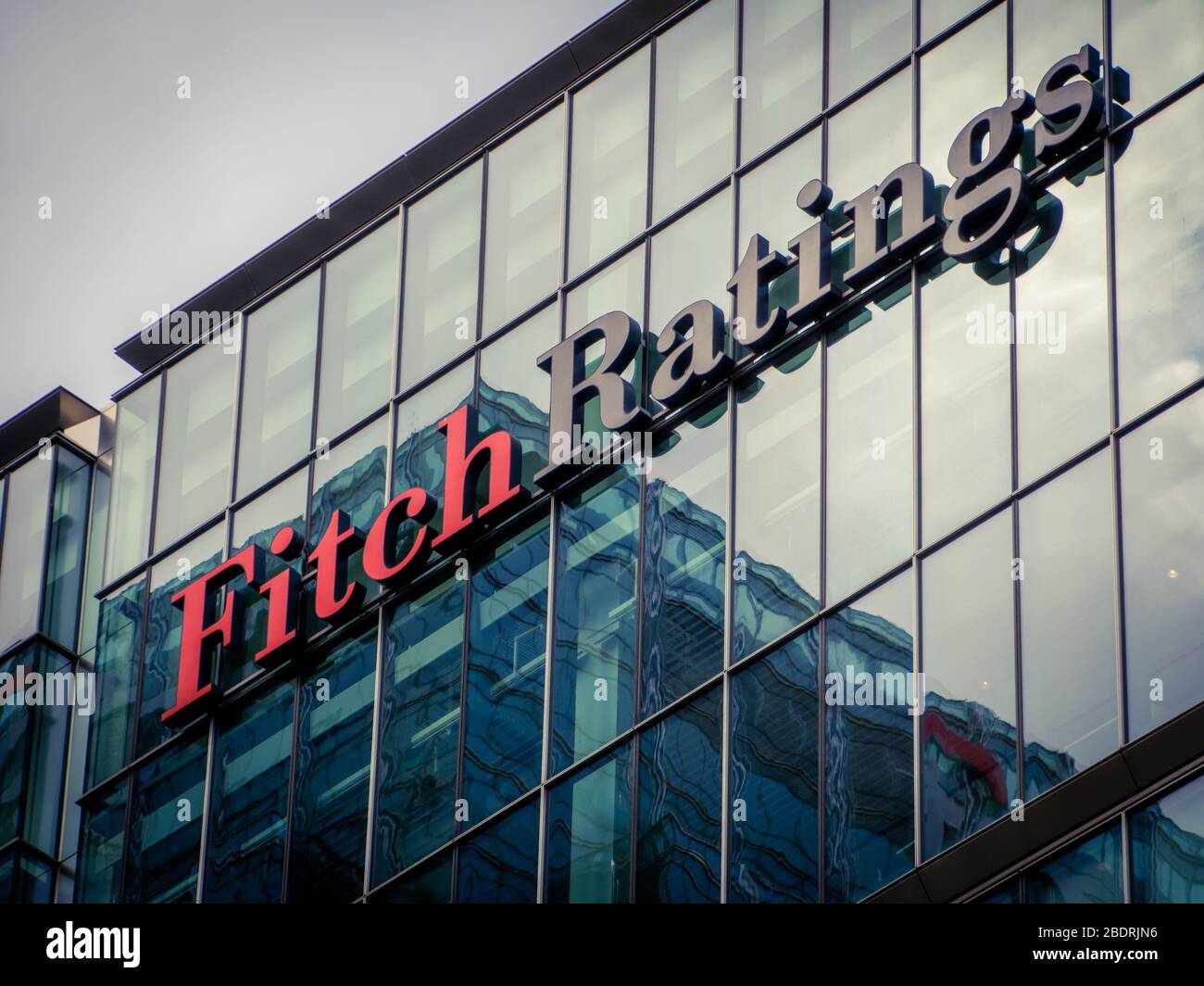 LONDON-  Fitch Ratings exterior logo in Canary Wharf, one of the 'big three' credit ratings agencies. Stock Photo