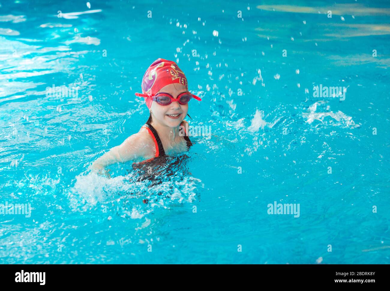 occupation in the pool of children with a swimming coach Stock Photo - Alamy
