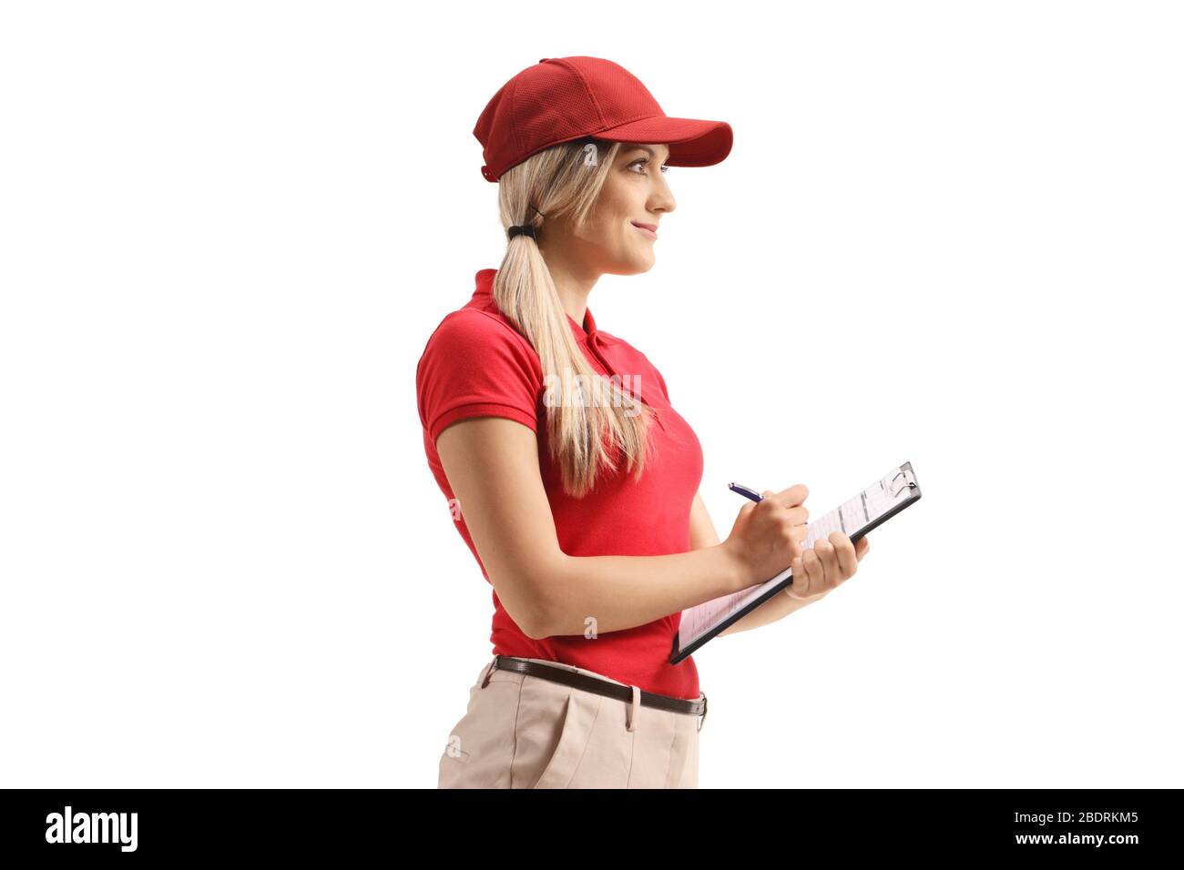 Delivery woman writing a document isolated on white background Stock Photo