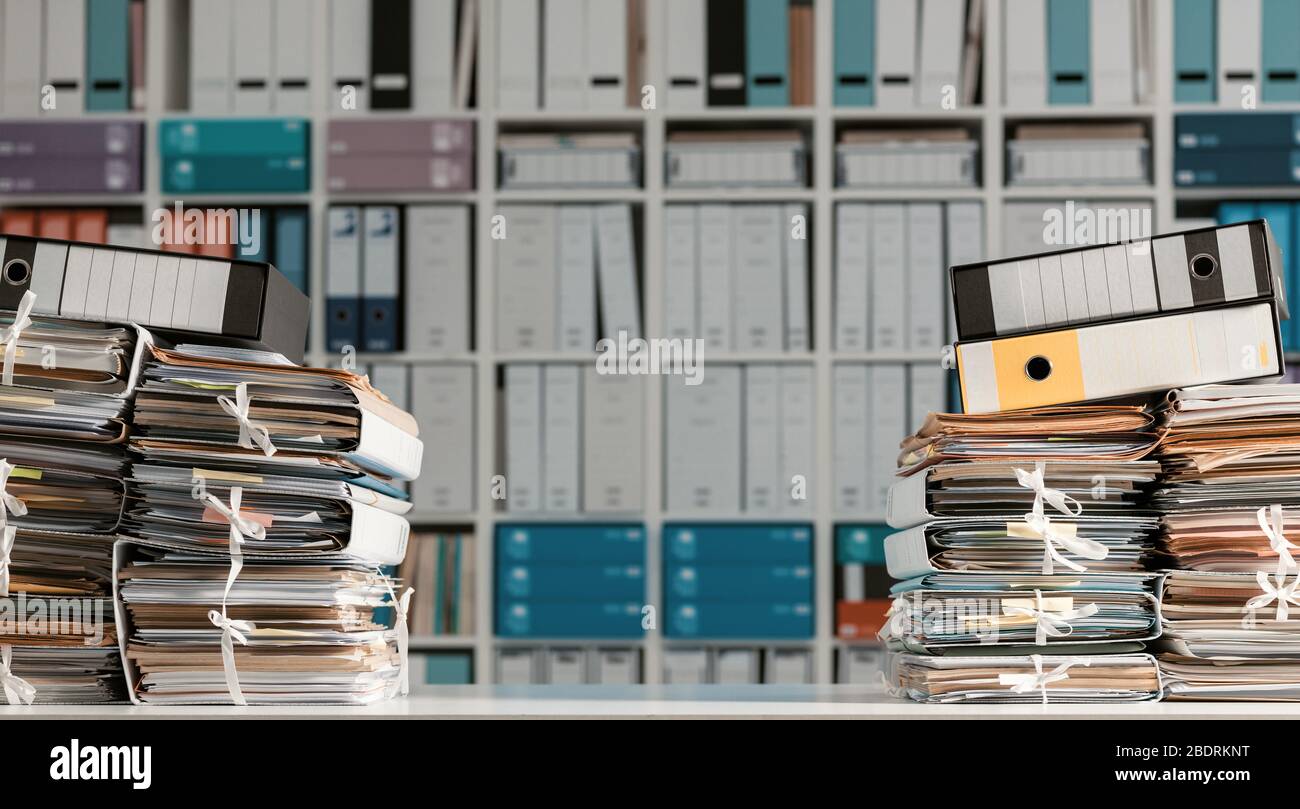 Stacks of files and paperwork in the office and bookshelves on the