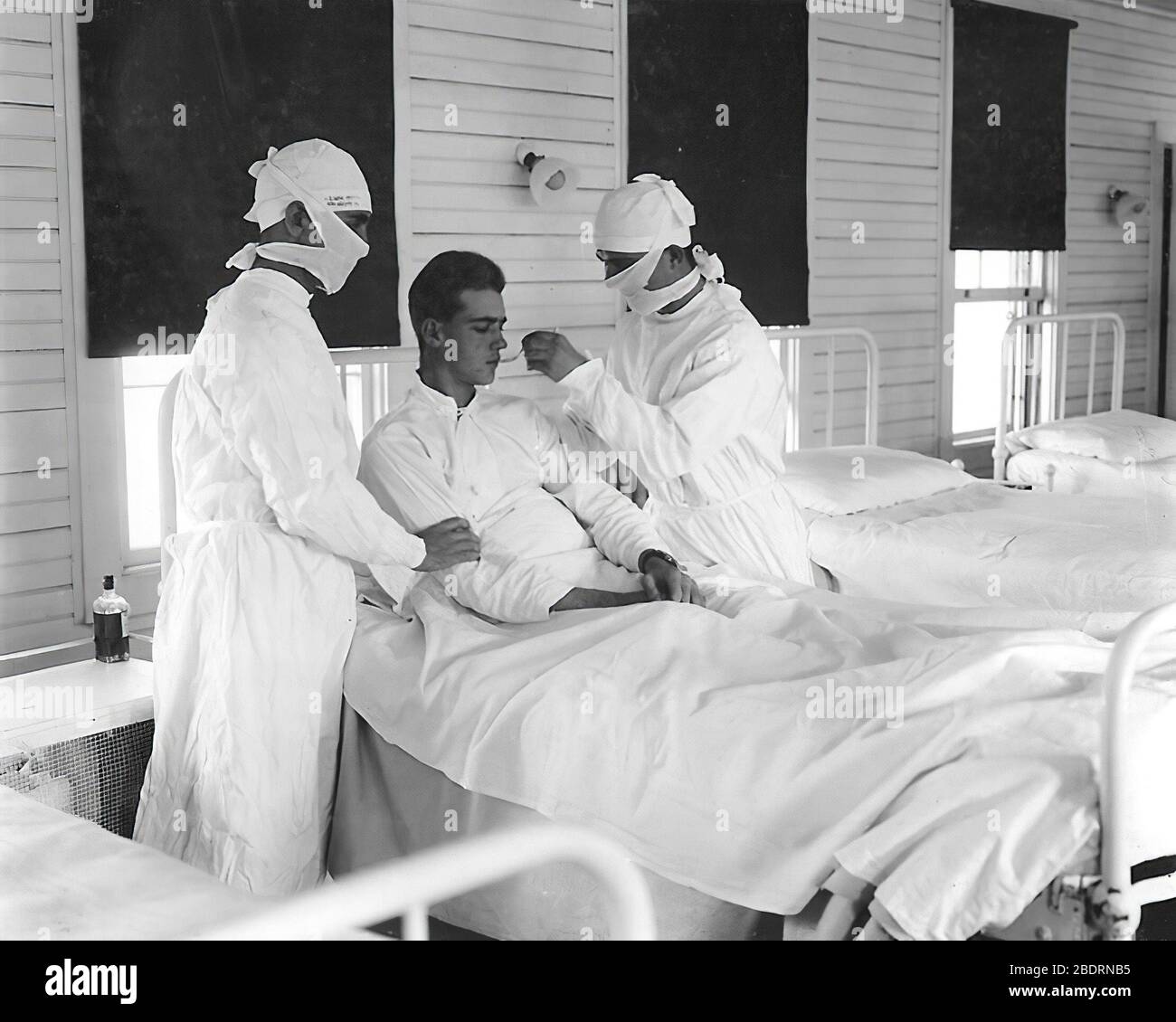 During the 1918 Spanish Flu Pandemic Masked medical personnel giving