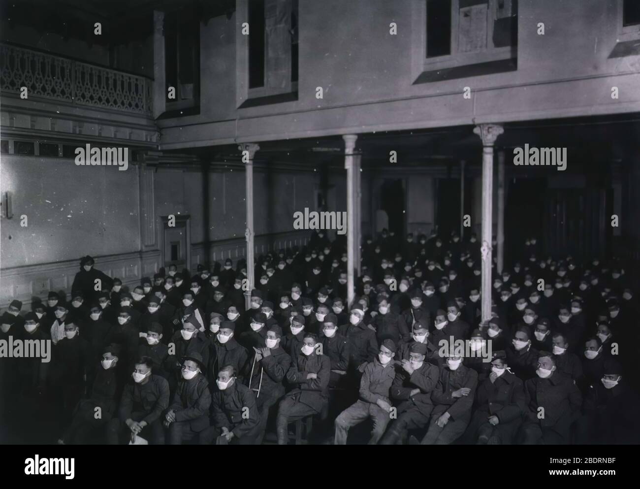 During the 1918 Spanish Flu Pandemic U. S. Army Hospital Number 30, Royat, France. Patients at moving picture show wearing masks because of an influenza epidemic Stock Photo
