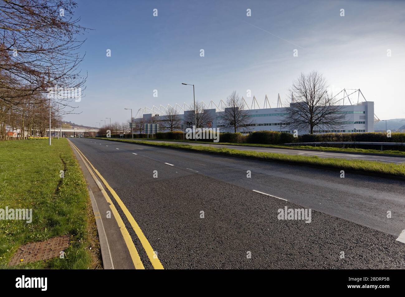 Pictured: The A4067 dual carriageway outside the Liberty Stadium is empty of cars during rush hour in Swansea, Wales, UK. Tuesday 24 March 2020 Re: Co Stock Photo