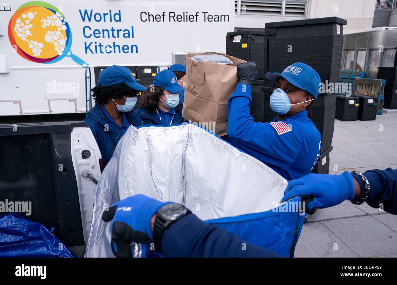 Washington, United States. 09th Apr, 2020. Workers with the nonprofit group SWBID pick up food to distribute to those in need from World Central Kitchen's makeshift distribution site at Nationals Park in Washington, DC on Thursday, April 9, 2020. Jose Andres's World Central Kitchen is using Nationals Park to prepare and distribute food to agencies that help needed individuals during the Coronavirus pandemic. Photo by Kevin Dietsch/UPI Credit: UPI/Alamy Live News Stock Photo
